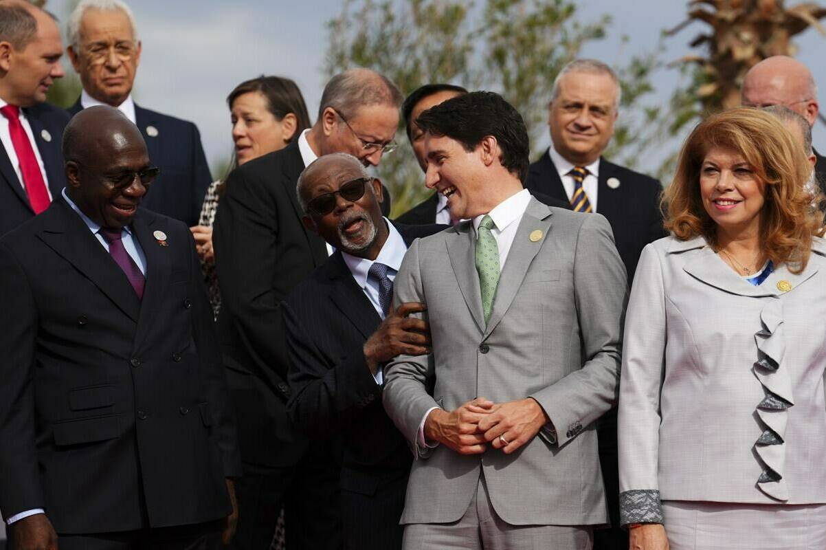 Prime Minister Justin Trudeau laughs with fellow leaders as they take part in the family photo during the Francophonie Summit in Djerba, Tunisia on Saturday, Nov. 19, 2022. THE CANADIAN PRESS/Sean Kilpatrick