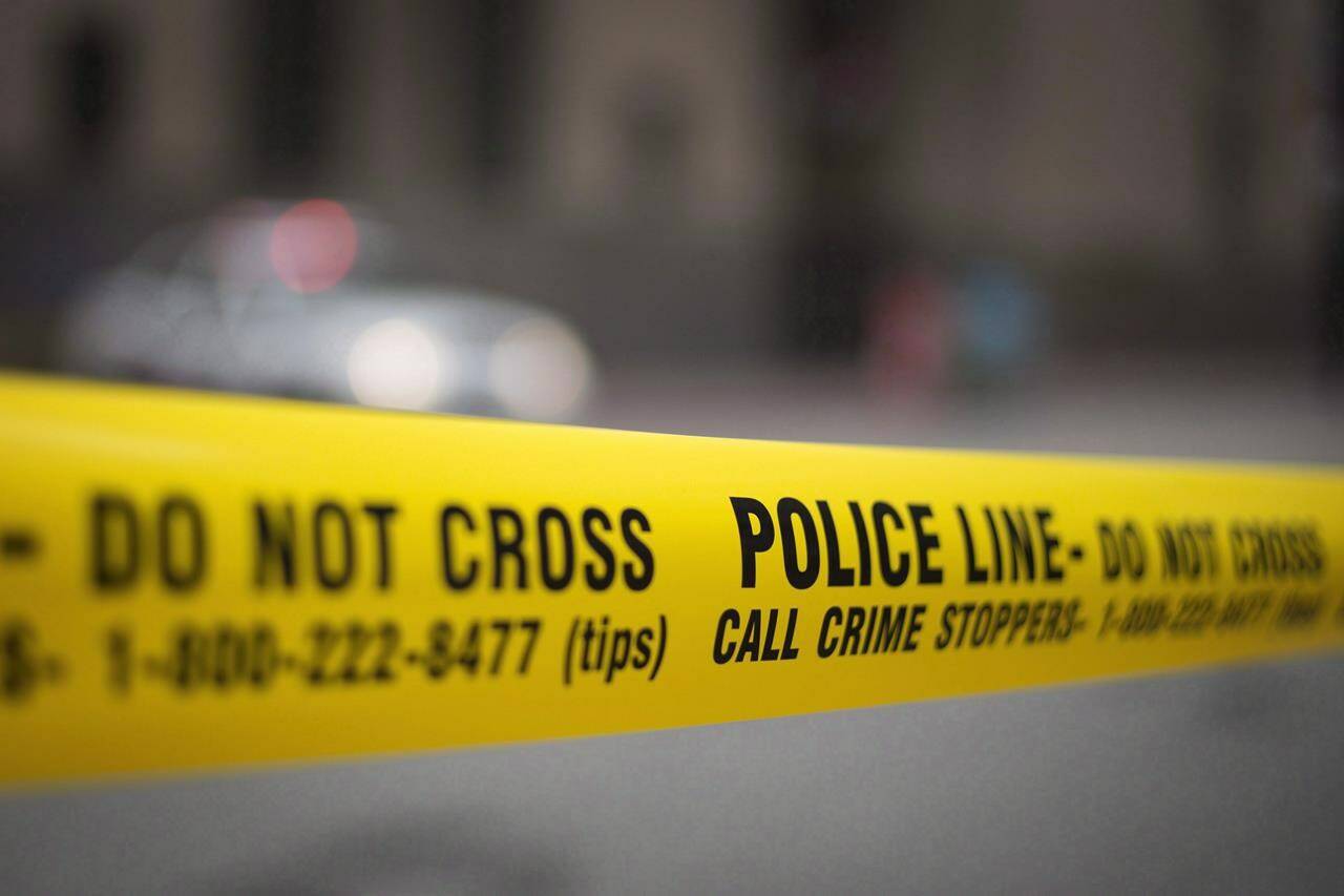 Police tape is shown in Toronto, Tuesday, May 2, 2017. New Statistics Canada data shows there was an increase in homicides in 2021 and nearly one-quarter of the killings were connected to gangs.THE CANADIAN PRESS/Graeme Roy