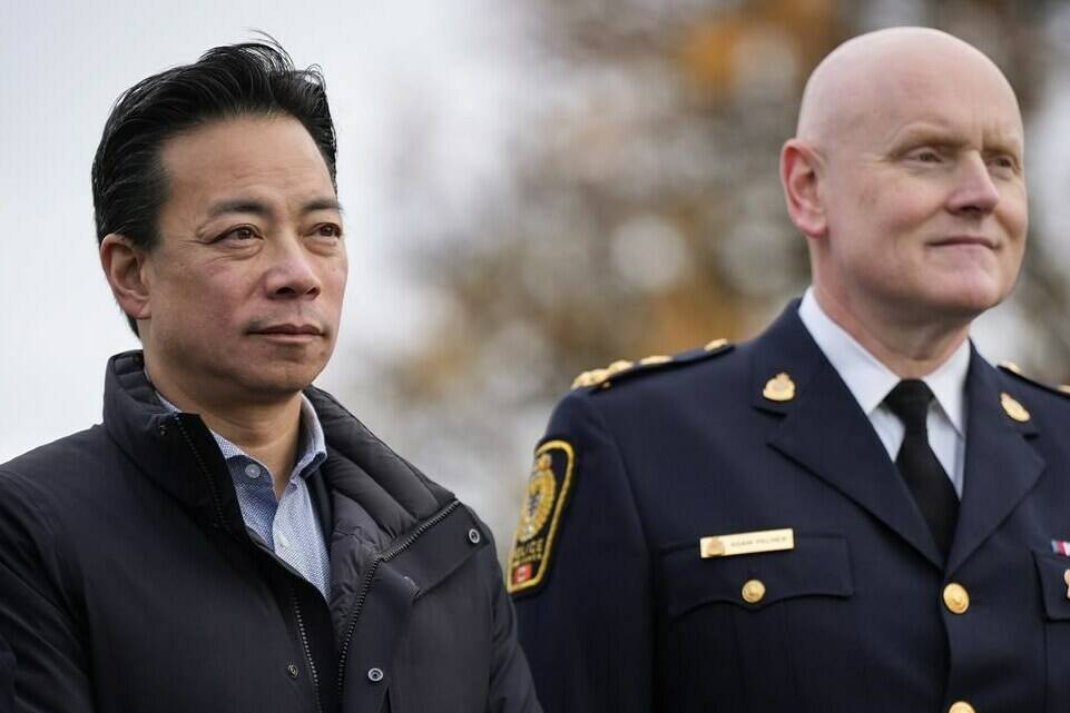 Vancouver Mayor Ken Sim, left, and Vancouver Police Chief Adam Palmer listen as B.C. Premier David Eby announces a new public safety plan in Vancouver on Sunday, November 20, 2022. THE CANADIAN PRESS/Darryl Dyck