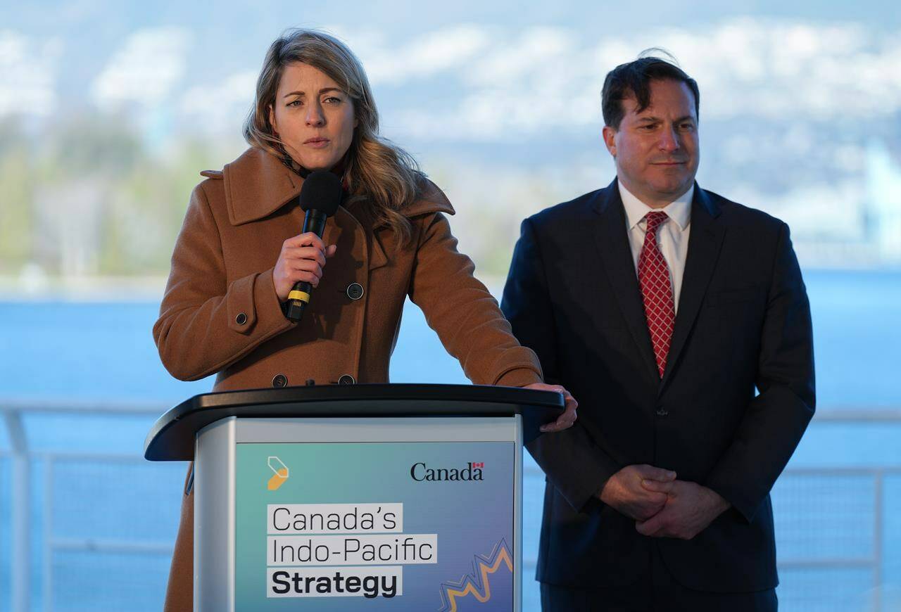 Minister of Foreign Affairs Melanie Joly, front left, responds to questions as Minister of Public Safety Marco Mendocino listens during a news conference to announce Canada’s Indo-Pacific strategy in Vancouver on Sunday, November 27, 2022. THE CANADIAN PRESS/Darryl Dyck