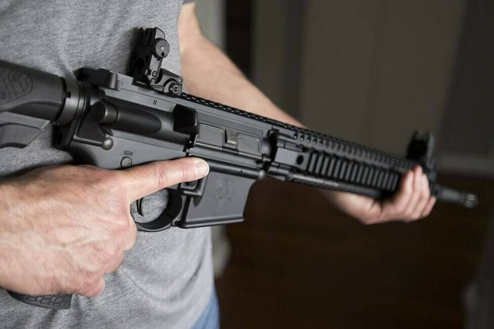 A restricted gun licence holder holds a AR-15 at his home in Langley, B.C. on May 1, 2020. A firearm advocacy group says the Liberal government’s effort to ban a wide variety of rifles is being driven by ideology, not public safety.THE CANADIAN PRESS/Jonathan Hayward