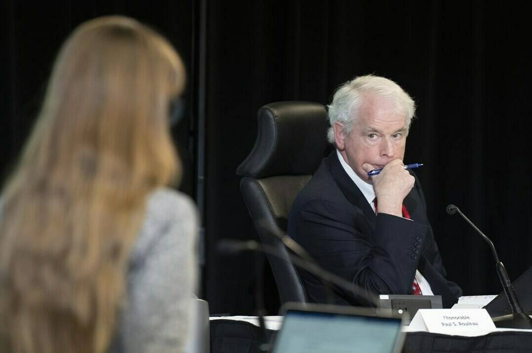 Commissioner Paul Rouleau listens to counsel question a witness at the Public Order Emergency Commission, in Ottawa, Friday, Nov. 4, 2022. Lawyers for “Freedom Convoy” organizers won their bid to gain access to unredacted versions of 20 documents at the Public Order Emergency Act. THE CANADIAN PRESS/Adrian Wyld
