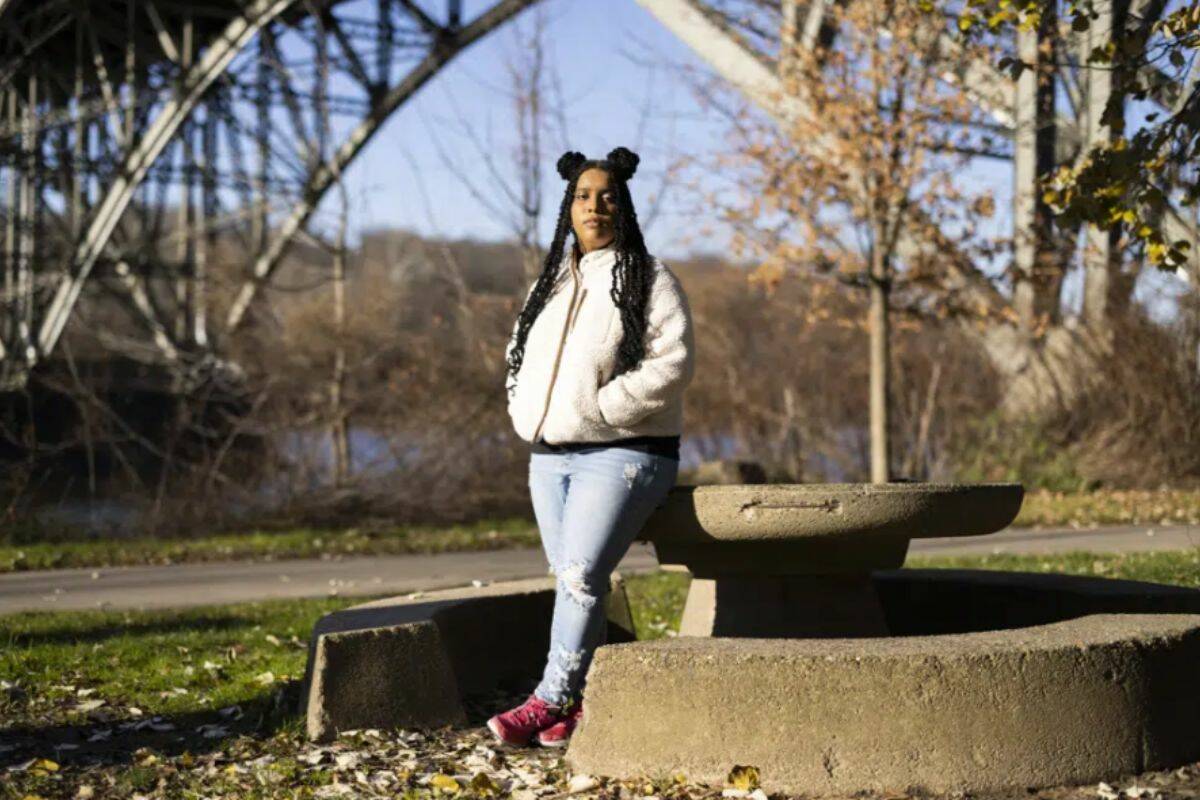 High school student Mecca Patterson-Guridy, 17, poses for a portrait in Philadelphia, Friday, Dec. 9, 2022. Scrutiny from conservatives around teaching about race, gender and sexuality has made many teachers reluctant to discuss issues that touch on cultural divides. To fill in gaps, some students, including Mecca, are looking to social media, where online personalities, nonprofit organizations and teachers are experimenting with ways to connect with them outside the confines of school. (AP Photo/Ryan Collerd)