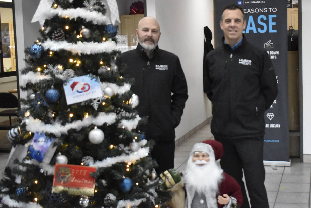 Julian Smallbone (right) and Will Seguin from Penticton’s Chevrolet Huber Bannister are giving away a 2010 Equinox SUV to one family in need this Christmas.