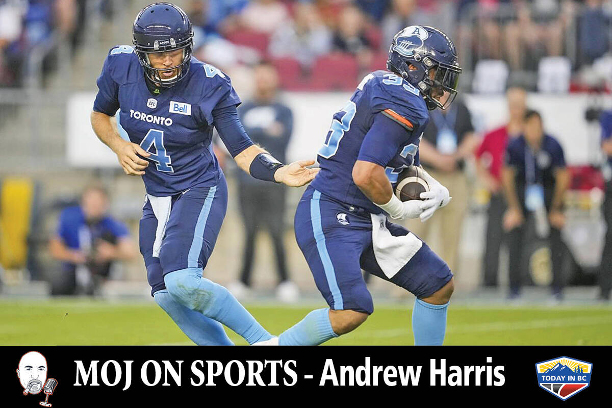 Toronto Argonauts quarterback McLeod Bethel-Thompson hands the ball off to teammate Andrew Harris during first half CFL football action against the Winnipeg Blue Bombers in Toronto Monday, July 4, 2022. (THE CANADIAN PRESS/Mark Blinch)