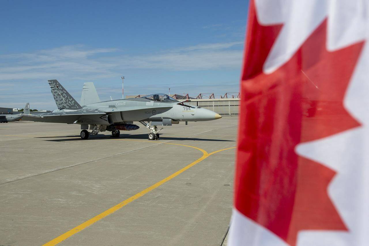 A CF-18 Hornet sits on the tarmac at Canadian Forces Base Trenton, in Trenton, Ont., on Monday June 20, 2022. A senior Air Force officer says the military will add more oversight over how call signs are assigned to fighter pilots. THE CANADIAN PRESS/Lars Hagberg