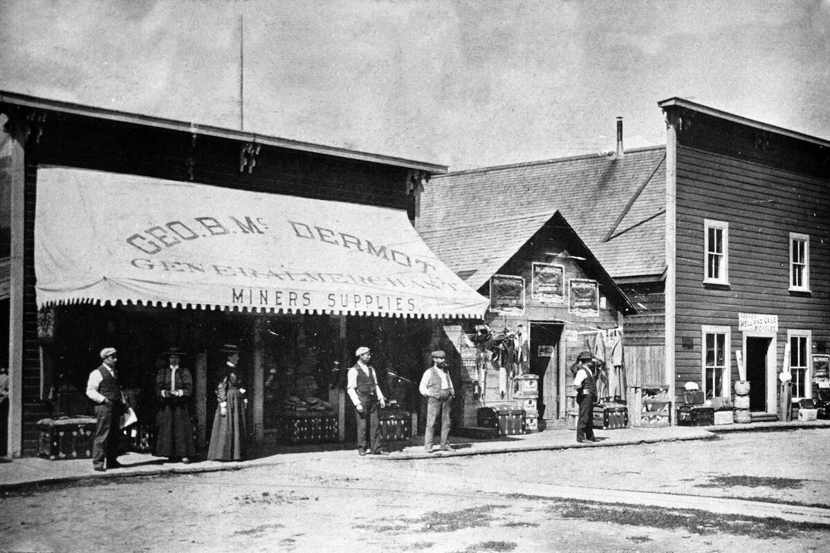 This historic photo is of George McDermot, a retired newspaper man, who came to Golden and took over the business previously opened by Mr. Lang. The business, opened in 1884 was a general merchandise store catering to miners and settlers. This building sat where Higher Ground is located today.

~ Golden Museum