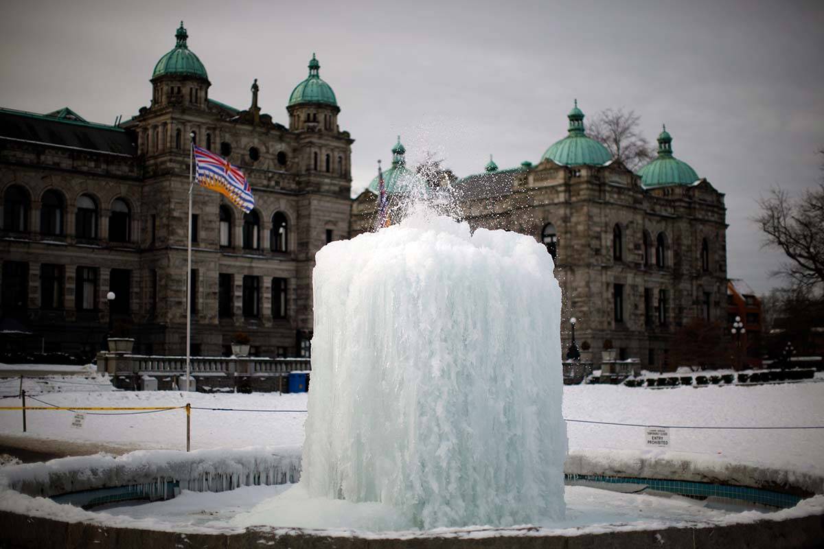 A January 1, 2022 file photo show the fountain at the B.C. legislature frozen over. It similarly froze on Dec. 20, as at least 15 B.C. communities set daily low temperature records. THE CANADIAN PRESS/Chad Hipolito