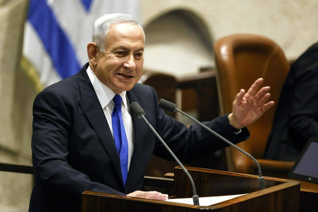 Israeli Prime Minister-designate Benjamin Netanyahu speaks during a special session of the Knesset, Israel’s parliament, to approve and swear in a new right-wing government, in Jerusalem Thursday, Dec. 29, 2022. Netanyahu was set to return to office Thursday at the helm of the most religious and ultranationalist government in Israel’s history, vowing to implement policies that could cause domestic and regional turmoil and alienate the country’s closest allies.(Amir Cohen/Pool Photo via AP)