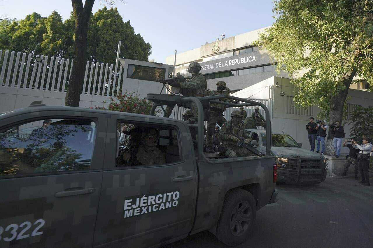 A heavily armed army convoy departs the prosecutor’s building where Ovidio Guzmán, one of the sons of former Sinaloa cartel boss Joaquin “El Chapo” Guzmán, is in custody in Mexico City, Thursday, Jan. 5, 2023. The mayor of a Mexican city caught up in a wave of drug cartel violence last week wasted little time reassuring Canadians and other foreign visitors that his city is safe for travellers. THE CANADIAN PRESS/AP-Fernando Llano