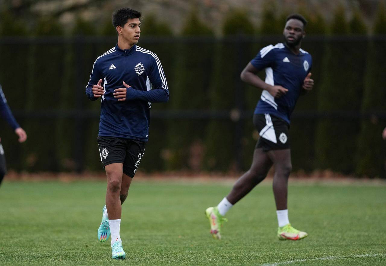 Vancouver Whitecaps defenders Mathias Laborda, front left, and Karifa Yao participate in a drill during the opening day of the MLS soccer team’s training camp, in Vancouver, on Monday, January 9, 2023. THE CANADIAN PRESS/Darryl Dyck