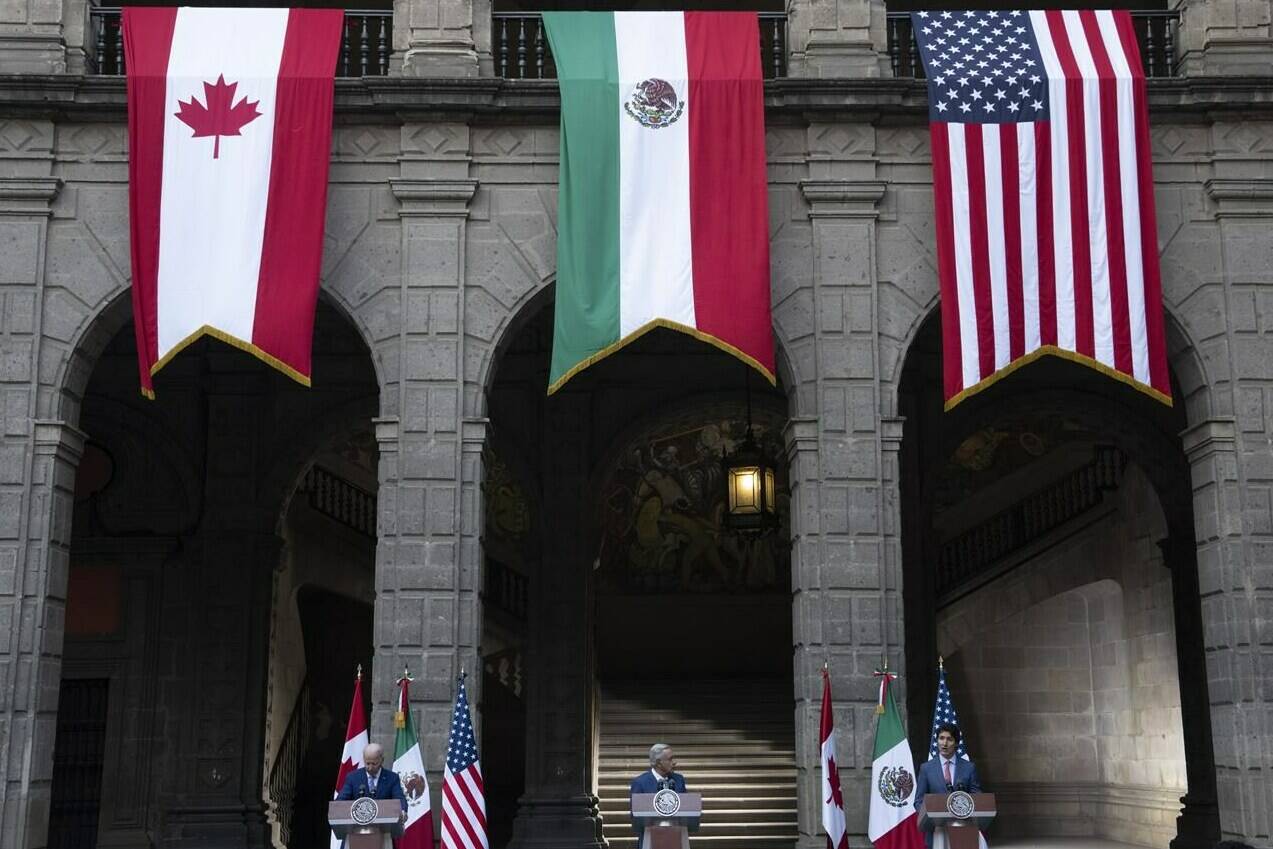 United States President Joe Biden and Mexican President Andres Manuel Lopez Obrador listen to Prime Minister Justin Trudeau speak during a joint news conference at the North American Leaders Summit Tuesday, January 10, 2023 in Mexico City, Mexico. THE CANADIAN PRESS/Adrian Wyld