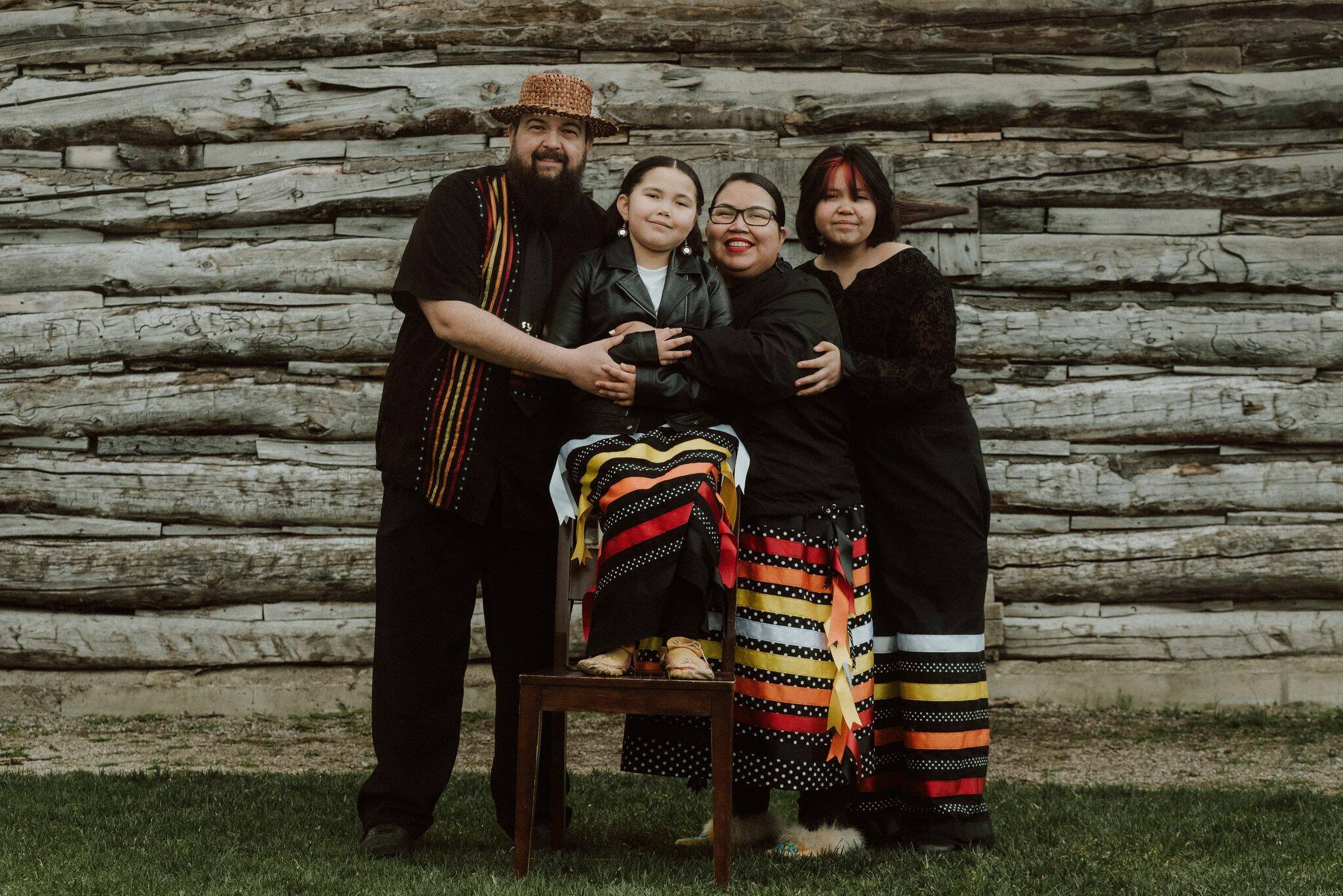 Jill Setah and her family wearing garments that she made. (Billie Jean Gabriel Photography/ Submitted)