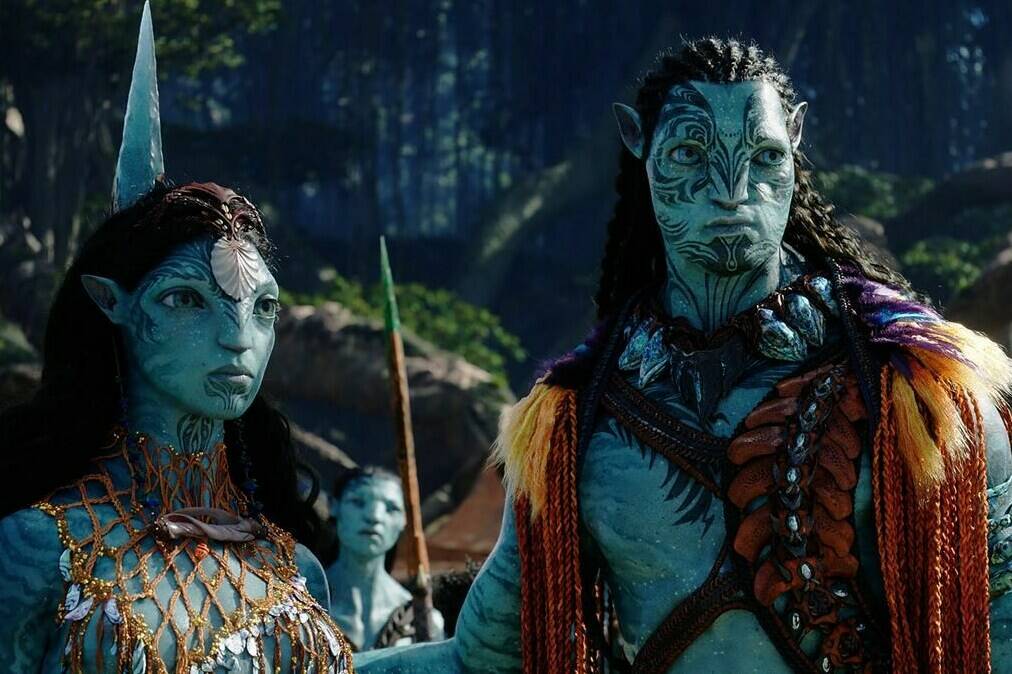 This image released by 20th Century Studios shows Kate Winslet, as Ronal, left, and Cliff Curtis, as Tonowari, in a scene from “Avatar: The Way of Water.” (20th Century Studios via AP)