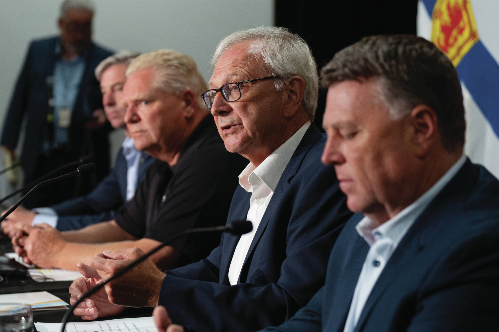 New Brunswick Premier Blaine Higgs, second from right, speaks during a press conference with, from left to right, Nova Scotia Premier Tim Houston, Ontario Premier Doug Ford, and Prince Edward Island Premier Dennis King in Moncton, N.B. on Monday, August 22, 2022. THE CANADIAN PRESS/Darren Calabrese