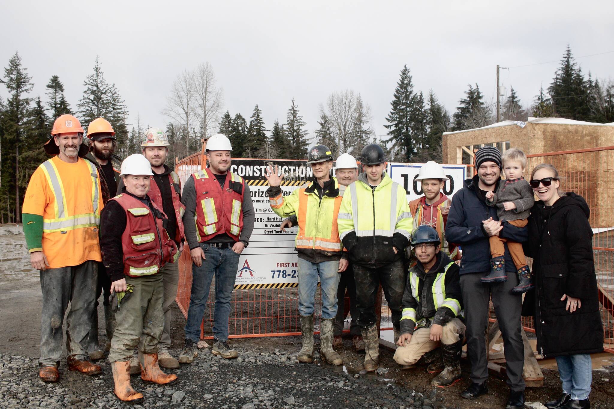 Nicole Hillier (left) reached out on Facebook asking for construction crews who would be interested in singing her son Phil happy birthday. Photo by Marc Kitteringham/Campbell River Mirror