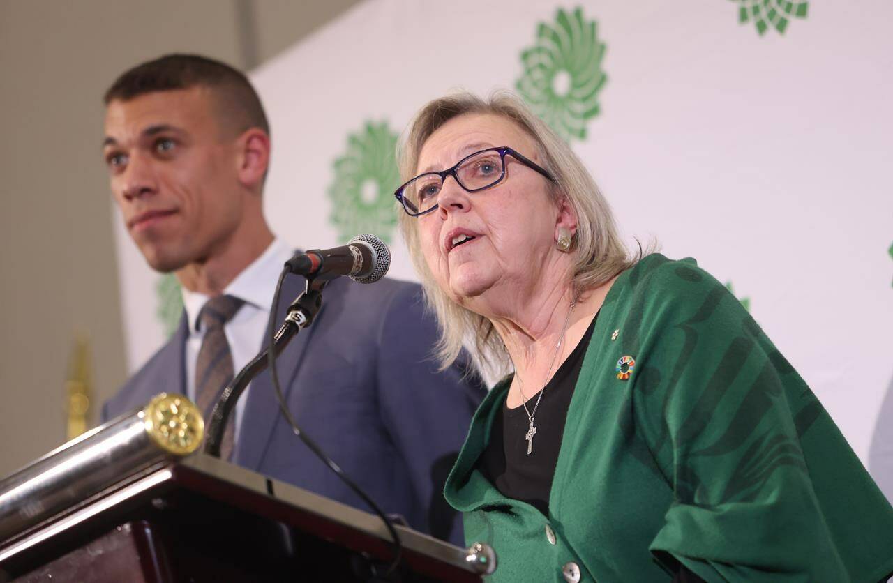 Elizabeth May speaks as co-leadership candidate Jonathan Pedneault looks on after May was elected the new leader of the Green Party in Ottawa on Saturday, November 19, 2022. THE CANADIAN PRESS/ Patrick Doyle