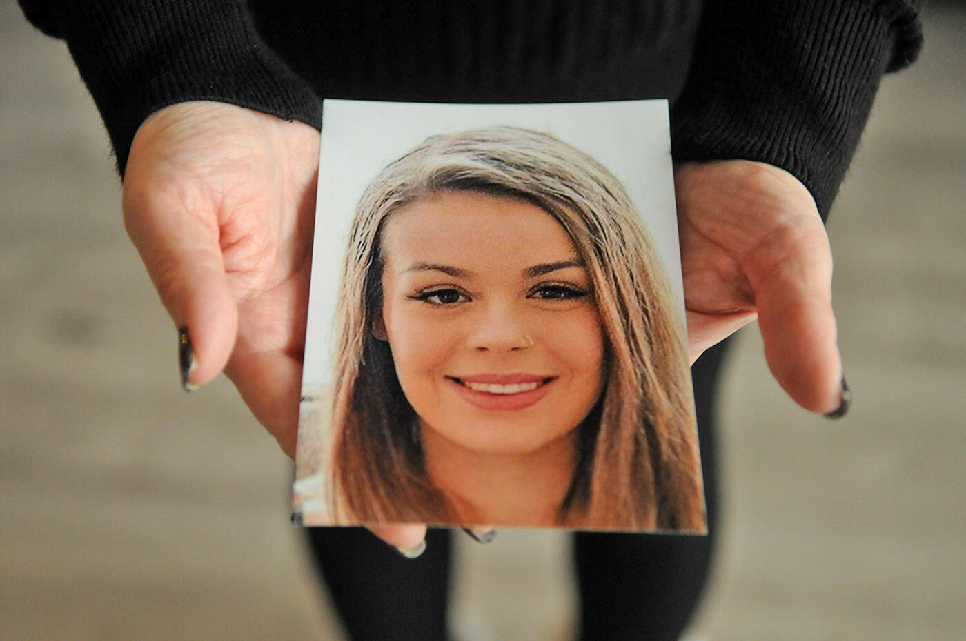 Alina Durham holds a photo of her daughter Shaelene Bell in her home on Jan. 12, 2023. Bell went missing on Jan. 30, 2021 and her body was found on June 2, 2021 in the Fraser River near Coquitlam. Durham has been trying for 18 months to get Shaelene’s Missing Adult Alert in place, but nothing has happened. (Jenna Hauck/ Chilliwack Progress)