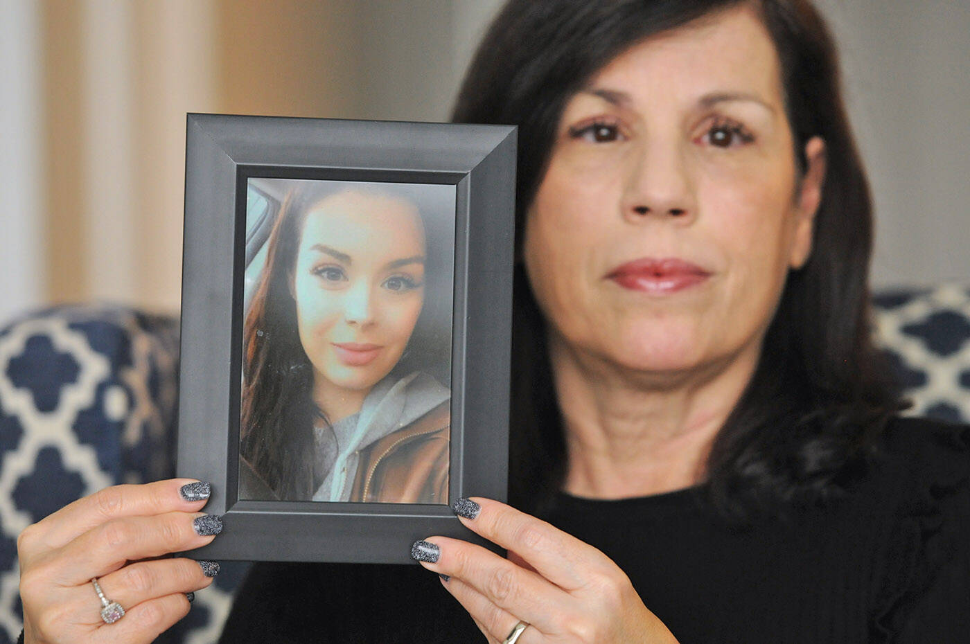Alina Durham holds a photo of her daughter Shaelene Bell in her home on Jan. 12, 2023. Bell went missing on Jan. 30, 2021 and her body was found on June 2, 2021 in the Fraser River near Coquitlam. Durham has been trying for 18 months to get Shaelene’s Missing Adult Alert in place, but nothing has happened. (Jenna Hauck/ Chilliwack Progress)
