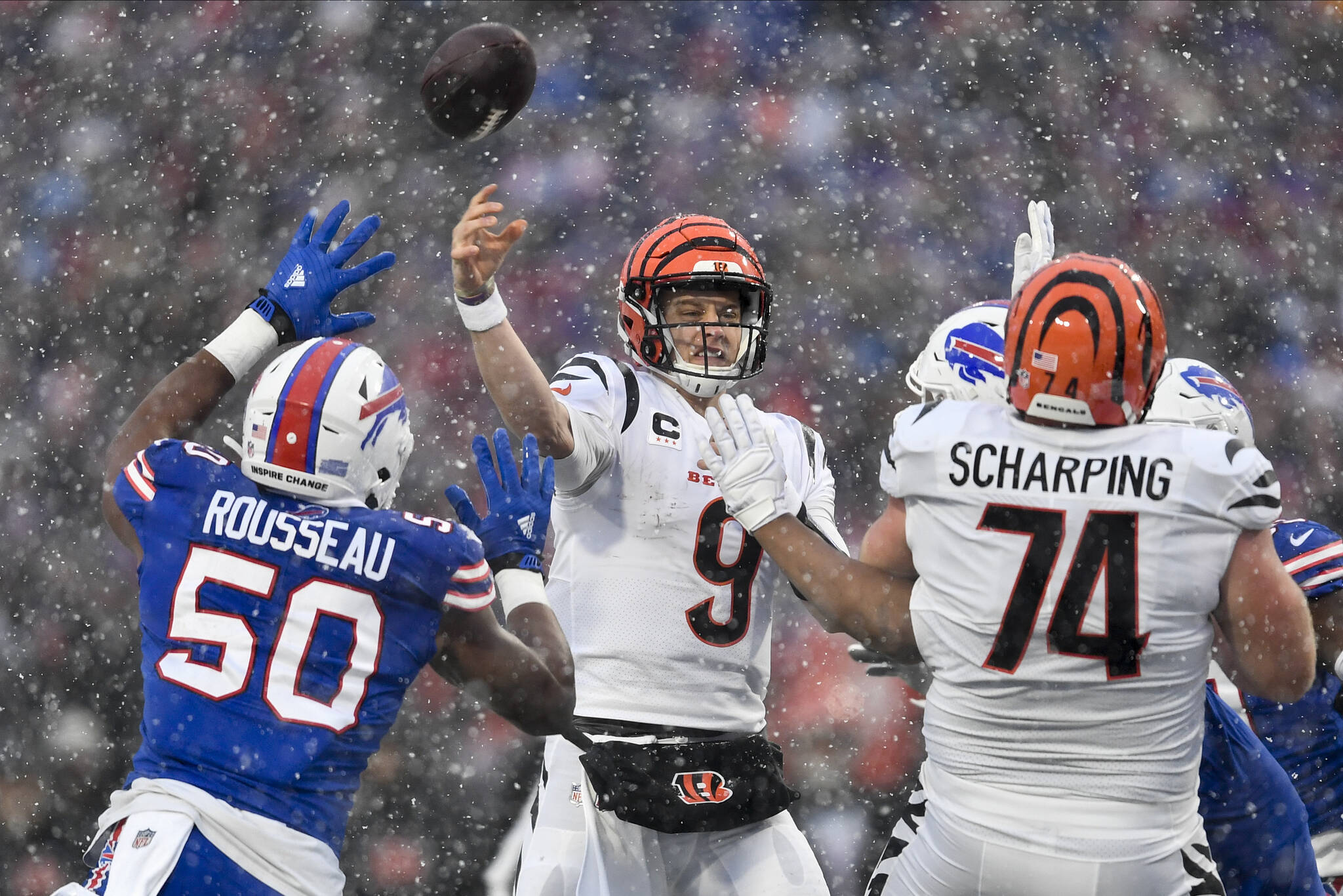 Cincinnati Bengals quarterback Joe Burrow (9) passes against the Buffalo Bills during the second quarter of an NFL division round football game, Sunday, Jan. 22, 2023, in Orchard Park, N.Y. (AP Photo/Adrian Kraus)