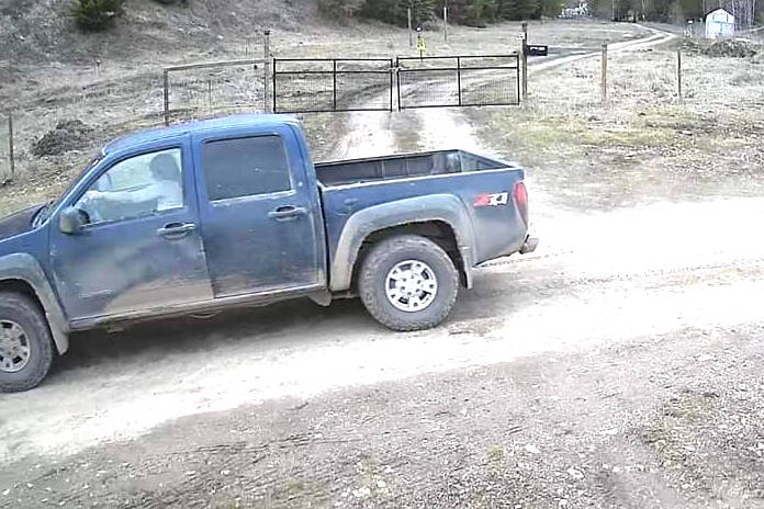 A blue pickup truck driven by a woman is captured on camera April 8 following a suspicious fire near Westwold. (surveillance image)