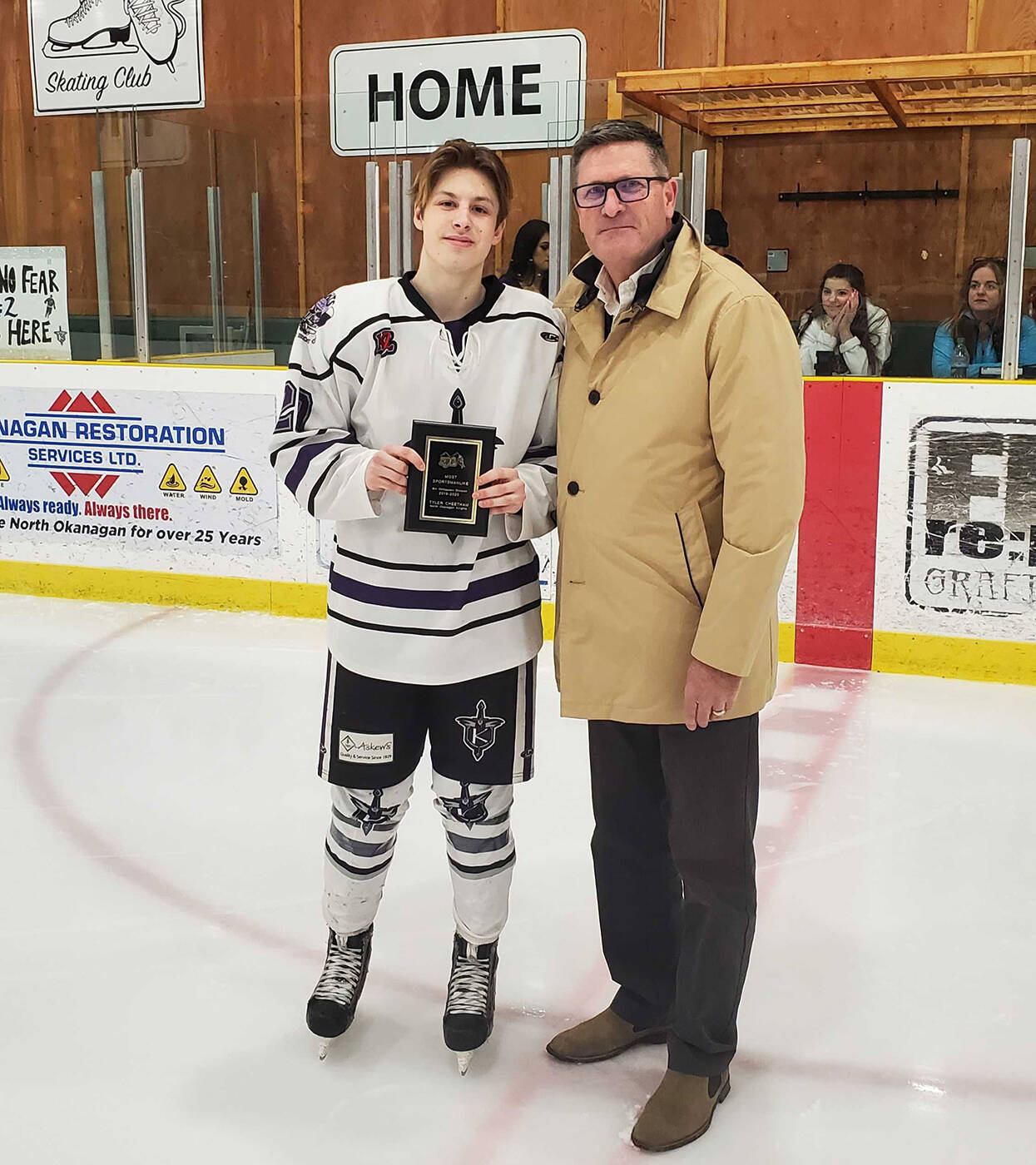 North Okanagan Knights forward Tyler Cheetham (left) is presented the Kootenay International Junior Hockey League's Bill Ohlhausen Division's Most Sportsmanlike Player Award by league president (and Armstrong native) Larry Martel prior to Game 3 of the Knights' divisional semifinal with the Kelowna Chiefs Monday, March 2, at the Nor-Val Sports Centre in Armstrong. (Roger Knox - Black Press)
