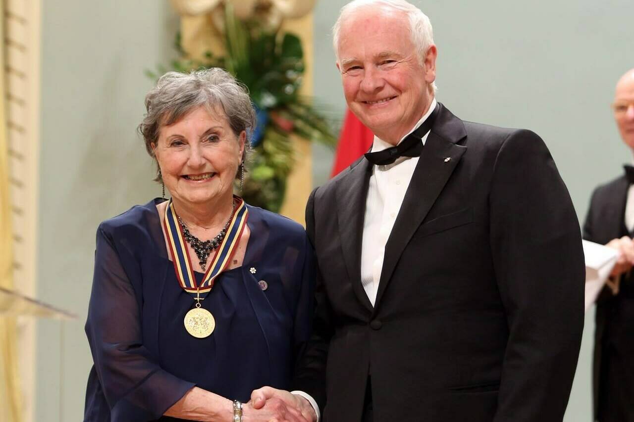 Actress and teacher Viola Leger receives the Lifetime Artistic Achievement Award for Theatre shakes hands with Governor General David Johnston during a ceremony of the Governor General’s Performing Arts Awards at Rideau Hall in Ottawa, May 31, 2013. THE CANADIAN PRESS/Fred Chartrand