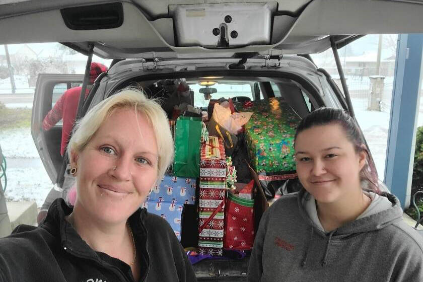 Crystal Hedlund (left), who operates a business, Crystal’s Baked Blessings, helps out families in need with Christmas dinners and gifts. (Submitted photo)