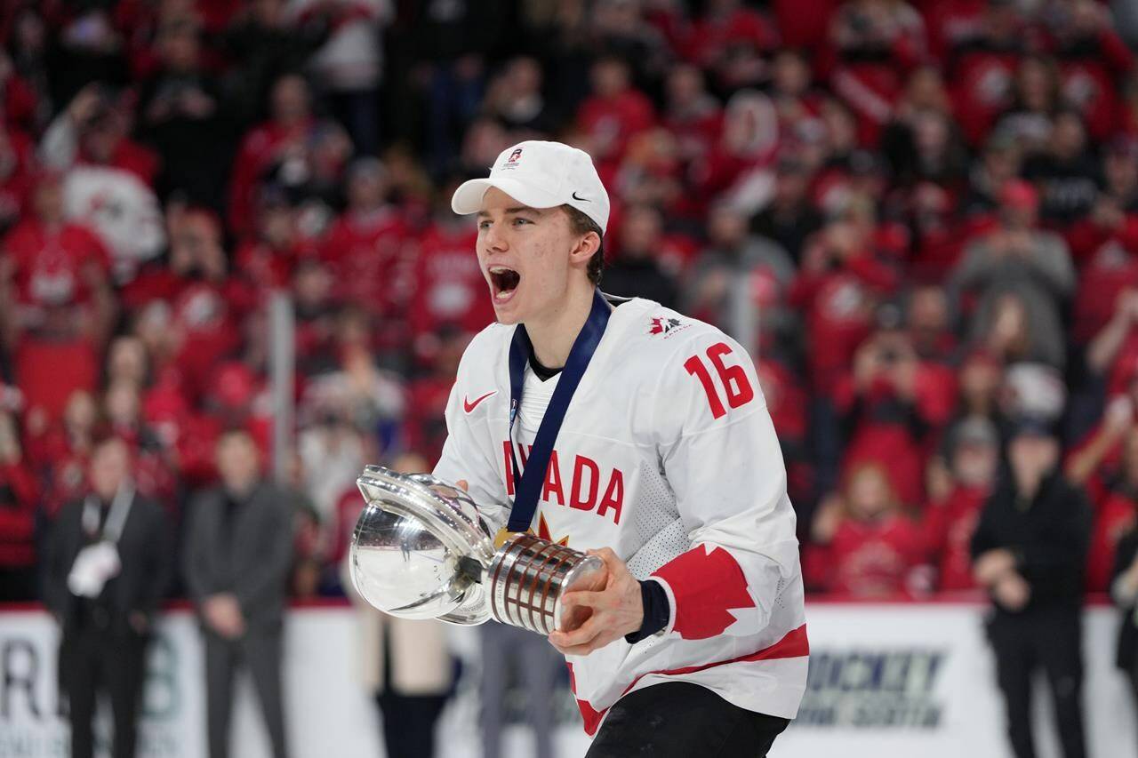 Canada’s Connor Bedard carries the IIHF Championship Cup while celebrating winning over Czechia at the IIHF World Junior Hockey Championship gold medal game in Halifax on Thursday, January 5, 2023. Connor Bedard keeps packing arenas in Western Canada after his electrifying performance at the world junior men’s hockey championship. THE CANADIAN PRESS/Darren Calabrese