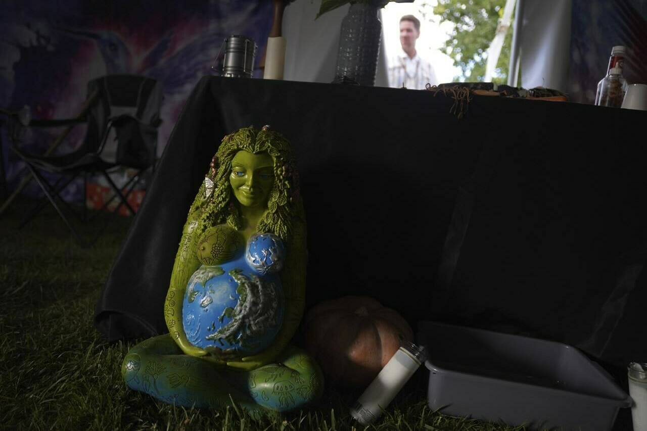 A statue of Mother Earth sits at the front of an altar used by a Colombian shaman, healer and traditional medicine man who leads the Hummingbird Church ayahuasca ceremonies, on Sunday, Oct. 16, 2022, in Hildale, Utah. Like many groups using psychedelics as sacraments, Hummingbird functioned underground for many years, hosting word of mouth ceremonies. But in Feb. 2021, they decided to go public. (AP Photo/Jessie Wardarski)