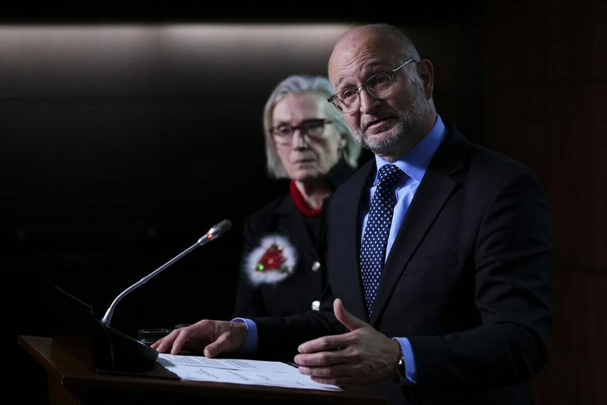 Minister of Justice and Attorney General of Canada David Lametti and Carolyn Bennett, Minister of Mental Health and Addictions and Associate Minister of Health, hold a press conference on Parliament Hill in Ottawa, Thursday, Dec. 15, 2022. THE CANADIAN PRESS/Sean Kilpatrick