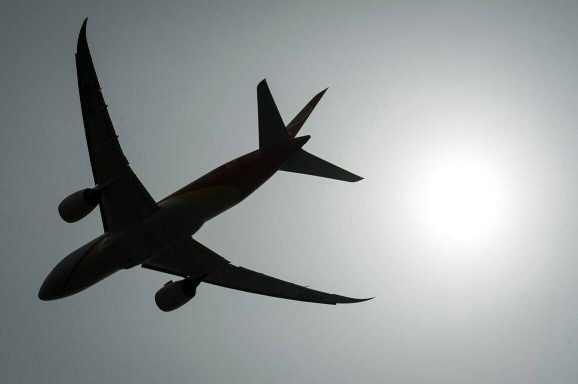 A plane is silhouetted as it takes off from Vancouver International Airport in Richmond, B.C., on May 13, 2019. A group of airlines are asking the Supreme Court of Canada to hear their case after a lower court ruling largely upheld the validity of Canada's air passenger bill of rights. THE CANADIAN PRESS/Jonathan Hayward