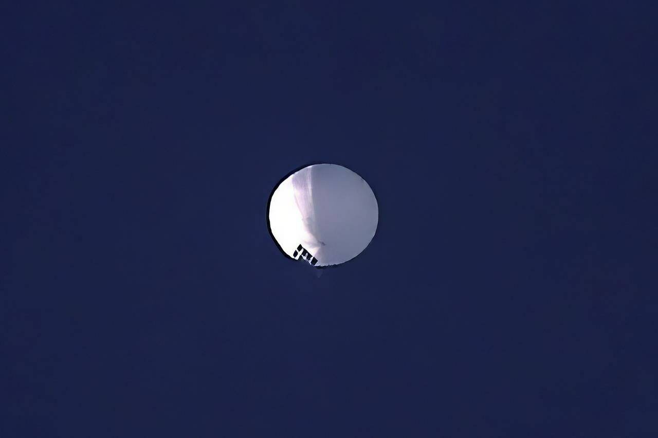 A high altitude balloon floats over Billings, Mont., on Wednesday, Feb. 1, 2023. The U.S. is tracking a suspected Chinese surveillance balloon that has been spotted over U.S. airspace for a couple days, but the Pentagon decided not to shoot it down due to risks of harm for people on the ground, officials said Thursday, Feb. 2, 2023. The Pentagon would not confirm that the balloon in the photo was the surveillance balloon. (Larry Mayer/The Billings Gazette via AP)