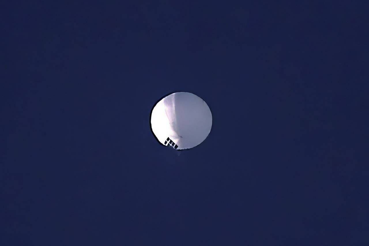 A high altitude balloon floats over Billings, Mont., on Wednesday, Feb. 1, 2023. China’s ambassador to Canada has been called onto the carpet to explain a high-altitude surveillance balloon that is hovering over the U.S. Global Affairs Canada says Ambassador Cong Peiwu was summoned on Thursday after the balloon was spotted over U.S. airspace. THE CANADIAN PRESS/The Billings Gazette via AP-Larry Mayer