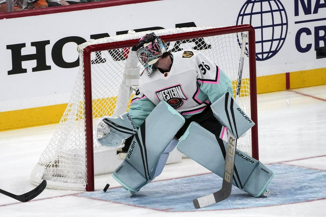 A shot from Central Division’s Seth Jones, of the Chicago Blackhawks (4) gets past Pacific Division’s goaltender Logan Thompson, of the Las Vegas Knights (36) during the NHL All Star hockey game, Saturday, Feb. 4, 2023, in Sunrise, Fla. (AP Photo/Marta Lavandier)