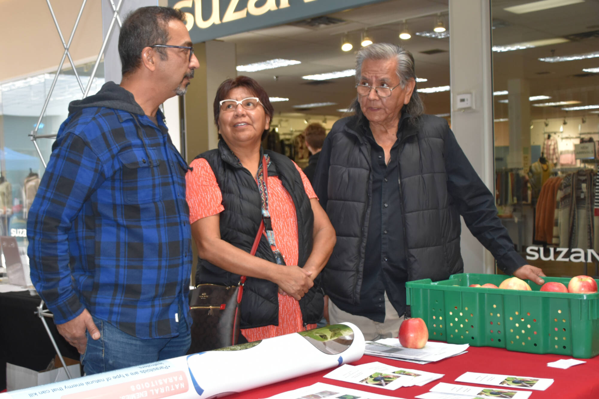 Mehdi Sharifi, research scientist with Agriculture and Agri-Food Canada, Frances Narcisse, now a Neskonlith councillor and Louis Thomas, Knowledge Keeper with the Neskonlith band, attend a Salmon Arm job fair in October 2022 to help get more Indigenous youth involved in Indigenous food research. (Martha Wickett - Salmon Arm Observer)