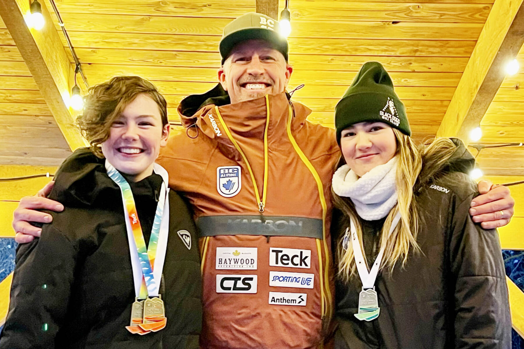 Alpine skiers Roxy Coatesworth and Madison Sherriff celebrate skiing their way onto Team with BC with Alpine VP Johnny Crichton. The girls will compete in the 2023 Canada Winter Games to be held from Feb.18 to March 5 in Prince Edward Island. (Contributed)