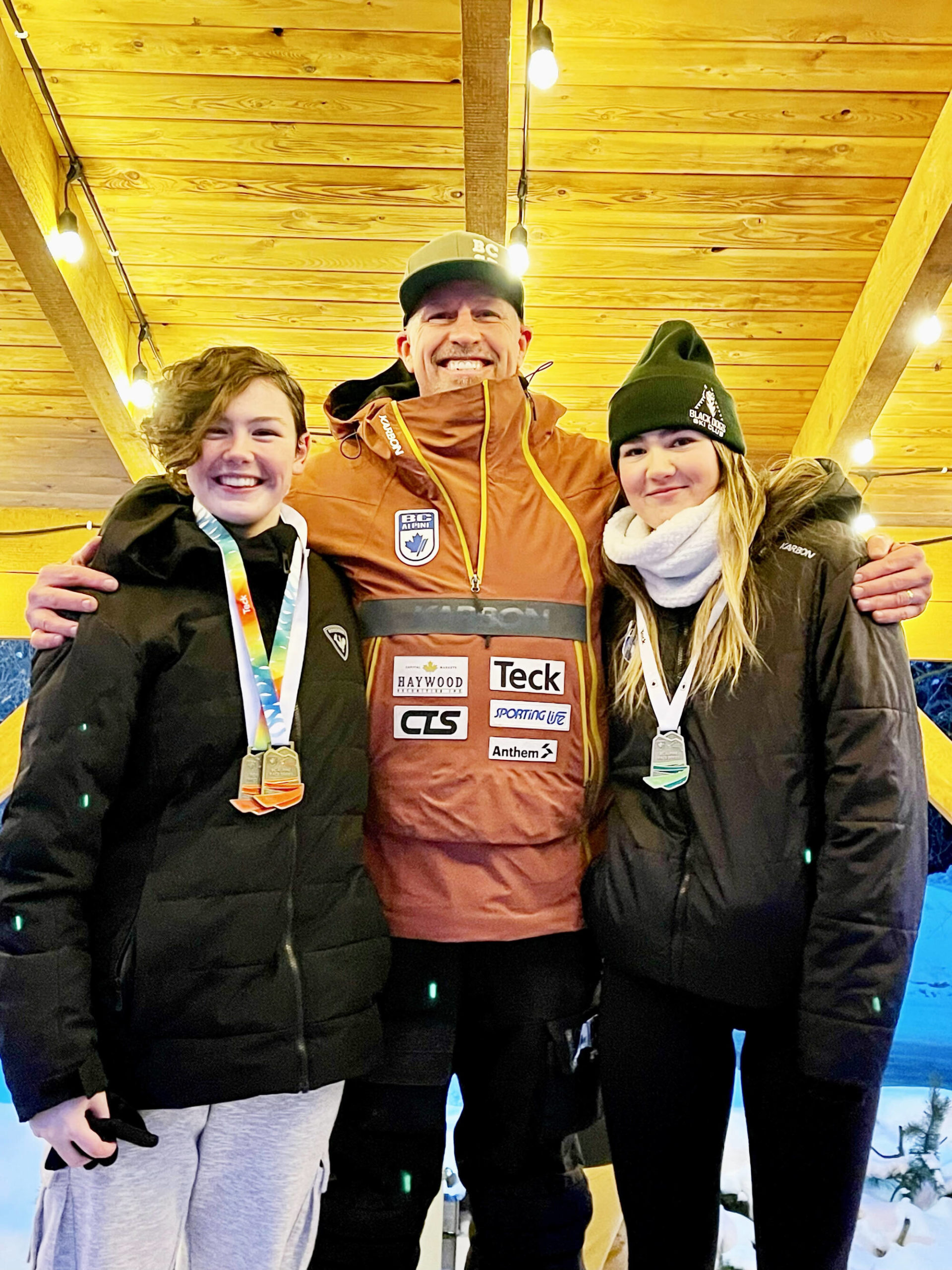 Alpine skiers Roxy Coatesworth and Madison Sherriff celebrate skiing their way onto Team with BC with Alpine VP Johnny Crichton. The girls will compete in the 2023 Canada Winter Games to be held from Feb.18 to March 5 in Prince Edward Island. (Photo contributed)