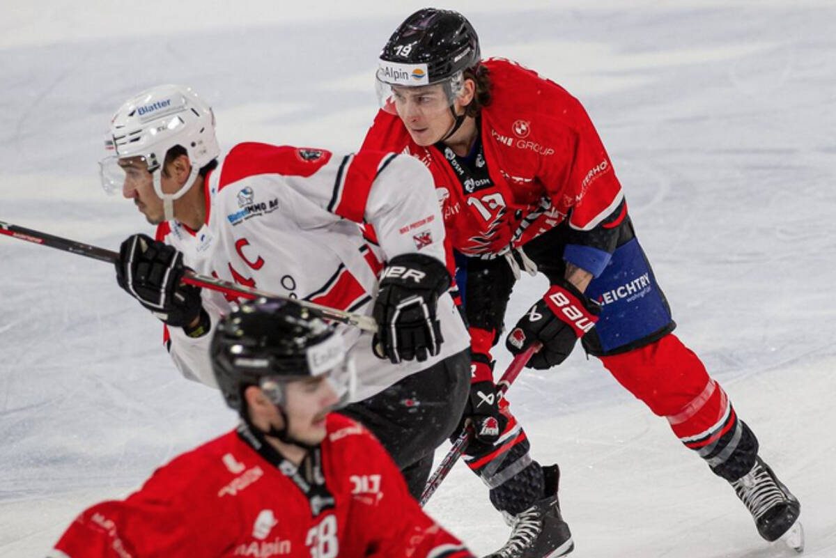 Abbotsford’s Jake Virtanen (red jersey) will compete in the Swiss League playoffs starting next week. (EHC Visp Instagram)