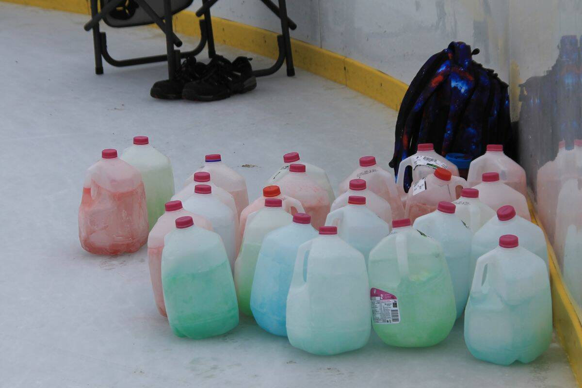 The kids are using milk jugs filled with water, then dyed with food colouring (Bowen Assman/Vernon Morning Star)