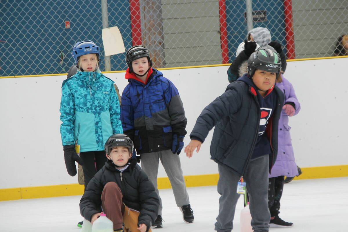 Grade 4 and 5 students at Alexis Park Elementary try their hand at curling on Tuesday, Feb. 7 (Bowen Assman/Vernon Morning Star)