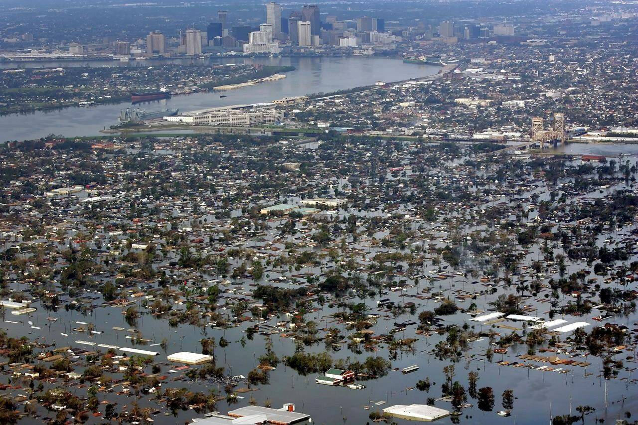 FILE - Floodwaters from Hurricane Katrina cover a portion of New Orleans on Aug. 30, 2005. The COVID-19 pandemic greatly accelerated a long-running pattern in giving by foundations and charities for health and natural disasters, a new Chronicle analysis of nine years of data show. (AP Photo/David J. Phillip, File)