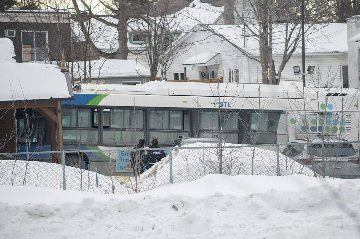 A city bus is shown next to a daycare centre in Laval, Que, Wednesday, Feb. 8, 2023, where the driver crashed it into the building leaving two children dead. THE CANADIAN PRESS/Graham Hughes