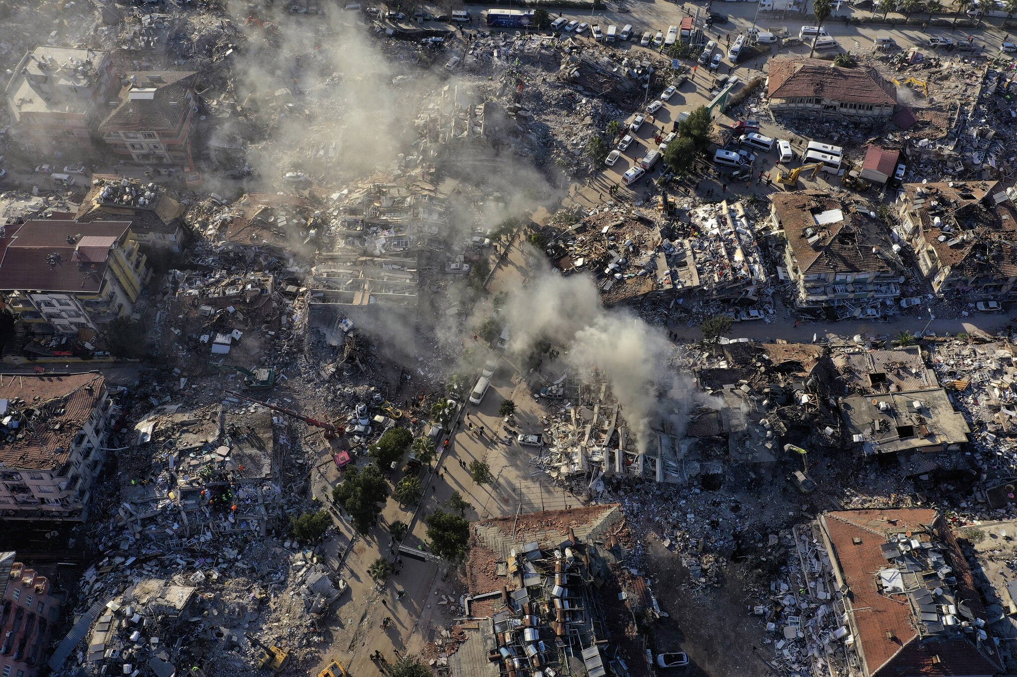 In this drone photo, destroyed buildings are seen from above in Antakya, southeastern Turkey, Thursday, Feb. 9, 2023. Thousands who lost their homes in a catastrophic earthquake huddled around campfires and clamored for food and water in the bitter cold, three days after the temblor and series of aftershocks hit Turkey and Syria. (AP Photo/Hussein Malla)