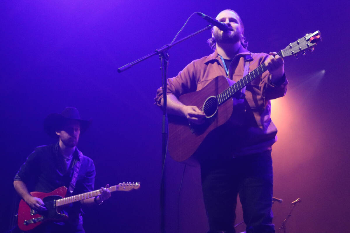 Kelowna’s Michael Daniels (right) with guitarist Austen Sawchuk got the party started Friday, Feb. 10, at Kal Tire Place as the opening act for the Vernon Winter Carnival A&W 2023 Snowglobe Country Barn Burner concert. (Roger Knox - Morning Star)