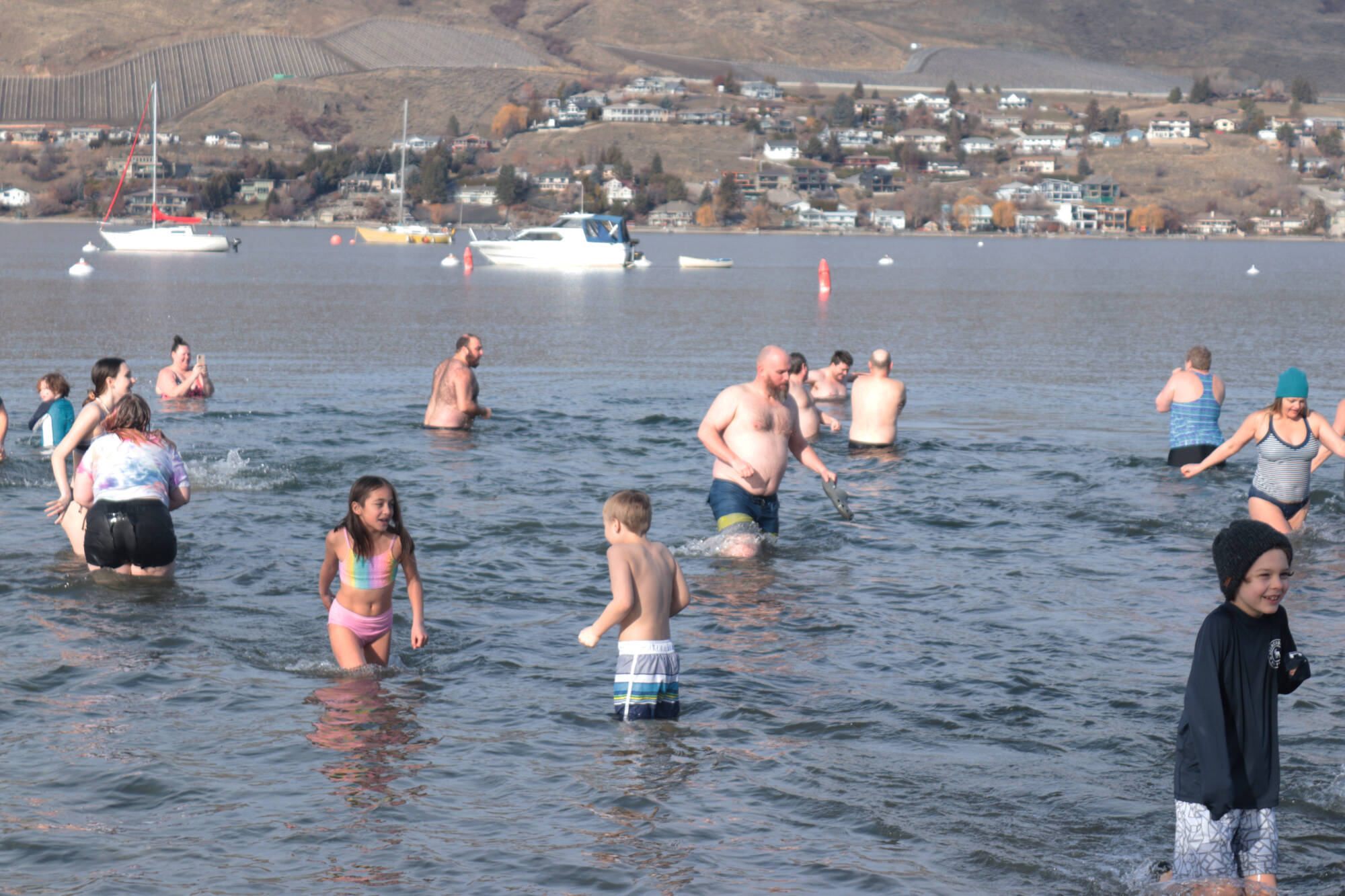 Dozens of people braved the cold and jumped into Okanagan Lake for the Vernon Winter Carnival Polar Bear Swim Saturday, Feb. 11, 2023. (Brendan Shykora - Morning Star)