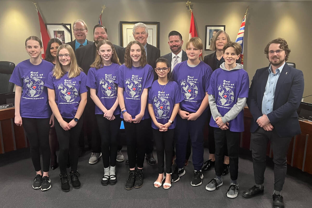Students from KVR Middle School pictured with Penticton mayor and council, following the declaration of Real Acts of Caring week. (Photo- City of Penticton)