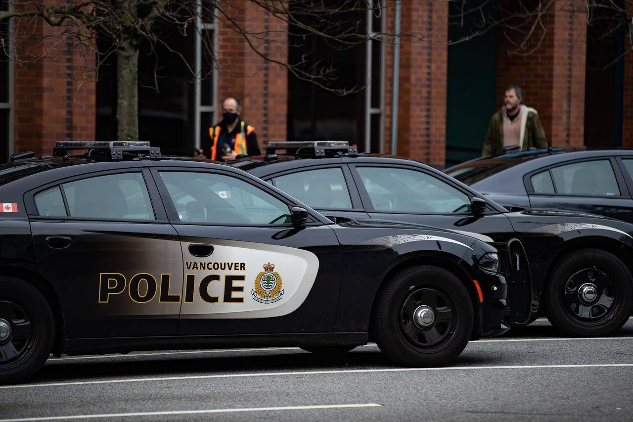 FILE - Police cars are seen parked outside Vancouver Police Department headquarters in Vancouver, on Saturday, January 9, 2021. THE CANADIAN PRESS/Darryl Dyck
