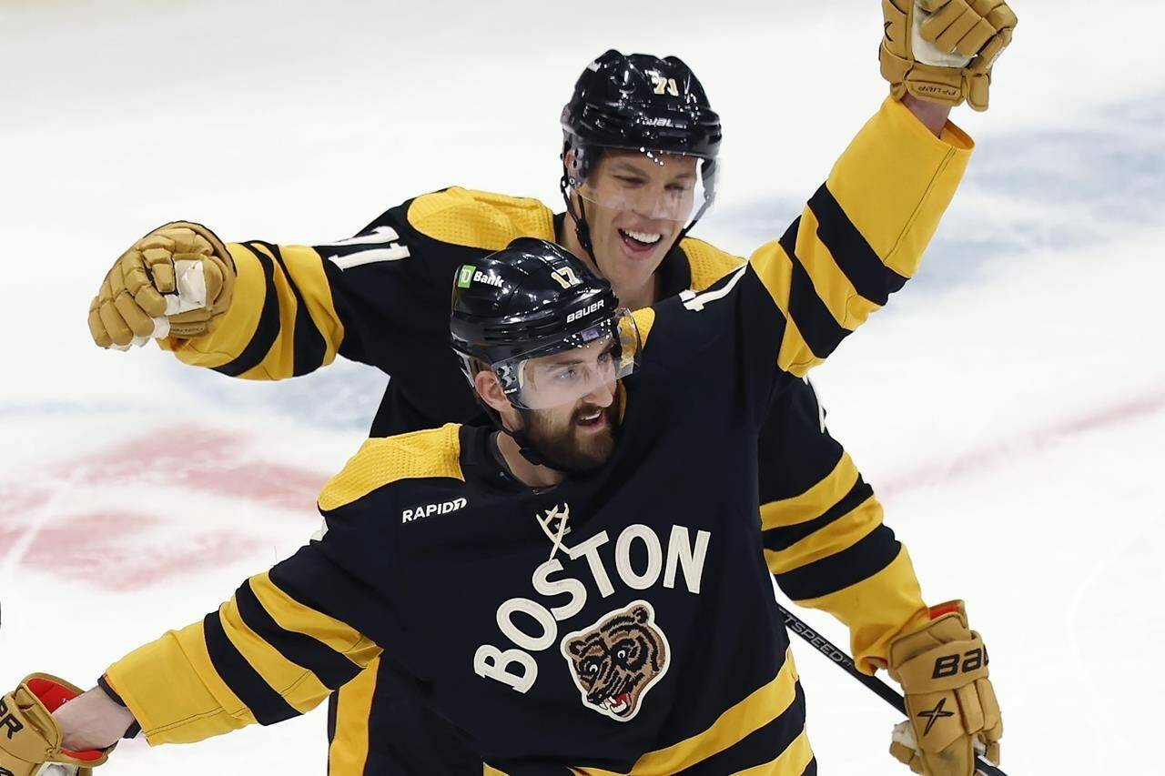 Boston Bruins’ Nick Foligno (17) celebrates after his goal with Taylor Hall (71) during the second period of an NHL hockey game against the Washington Capitals, Saturday, Feb. 11, 2023, in Boston. THE CANADIAN PRESS/AP-Michael Dwyer