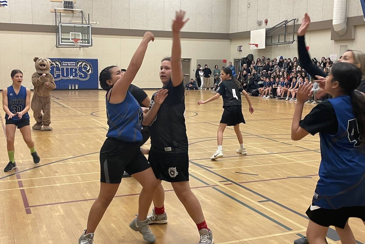 A charity basketball game took place at Cst. Neil Bruce School on Thursday afternoon (Feb. 16) between the grade eight boys and girls team combined and a team made up of members of the Westbank First Nation, West Kelowna Indigenous Policing Services, RCMP officers, and even former students. (Gary Barnes/Capital News)